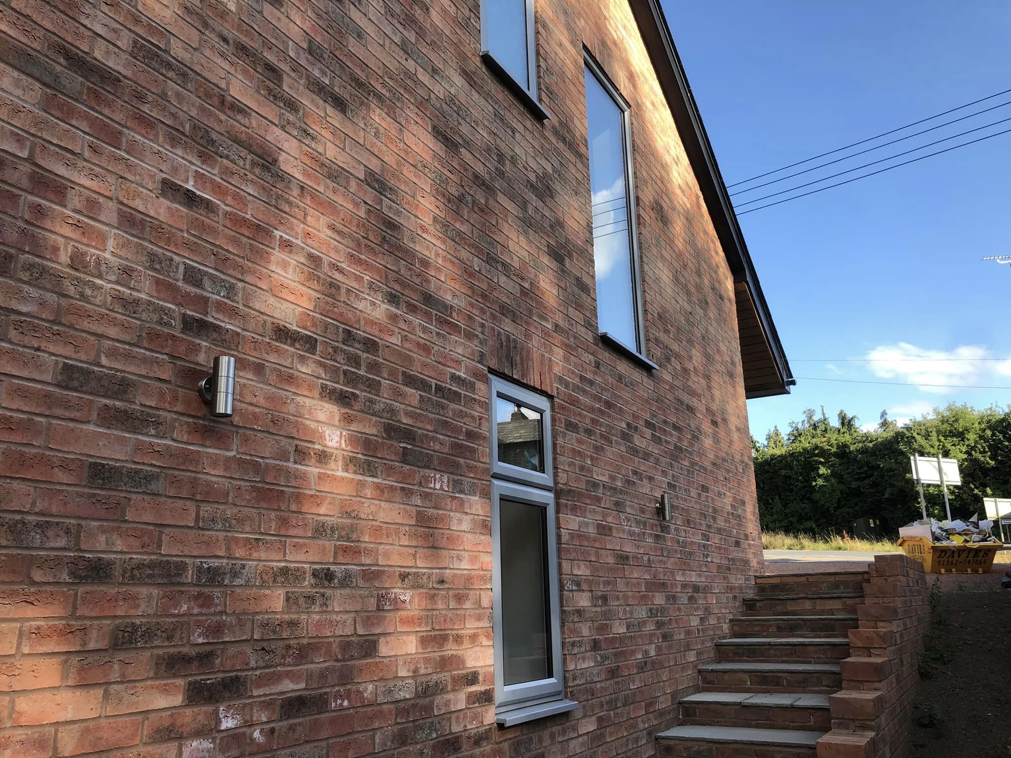 Two storey new build on split level site